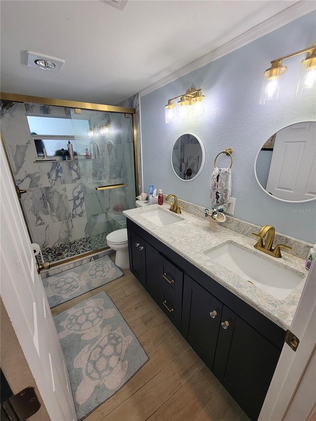 6737 Clark St, Hudson, FL 34667 - full bath with a marble finish shower, double vanity, and wood finished floors
