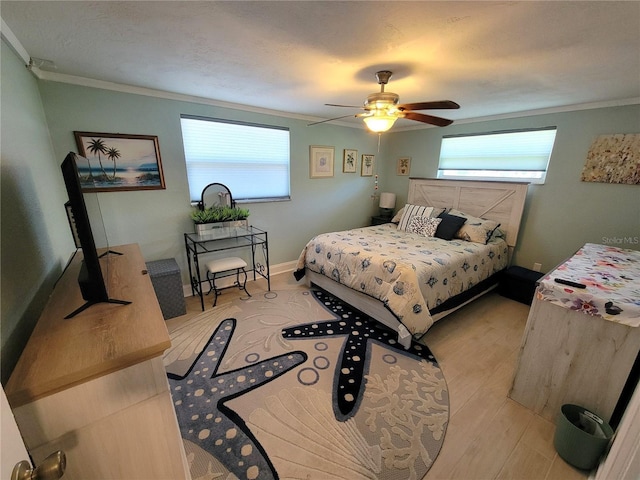 6737 Clark St, Hudson, FL 34667 - bedroom with ornamental molding, multiple windows, light wood finished floors, and ceiling fan