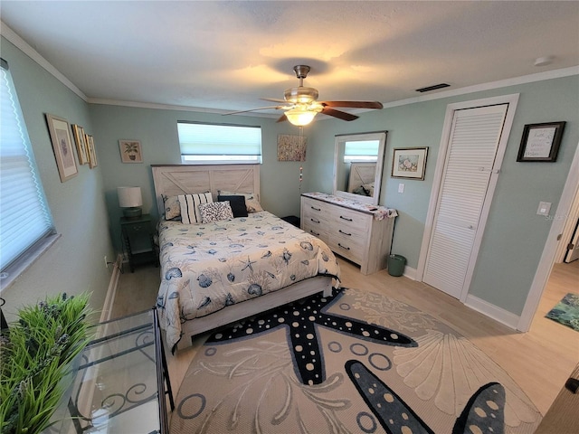 6737 Clark St, Hudson, FL 34667 - bedroom featuring light wood-type flooring, ornamental molding, and ceiling fan