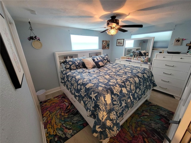 6737 Clark St, Hudson, FL 34667 - bedroom with wood finished floors and ceiling fan