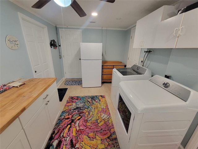 6737 Clark St, Hudson, FL 34667 - washroom featuring independent washer and dryer, ceiling fan, light wood-style flooring, and cabinet space