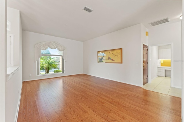 7328 Blue Skies Dr, Spring Hill, FL 34606 - spare room featuring light wood-type flooring and baseboards
