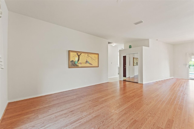 7328 Blue Skies Dr, Spring Hill, FL 34606 - empty room featuring light wood finished floors and baseboards