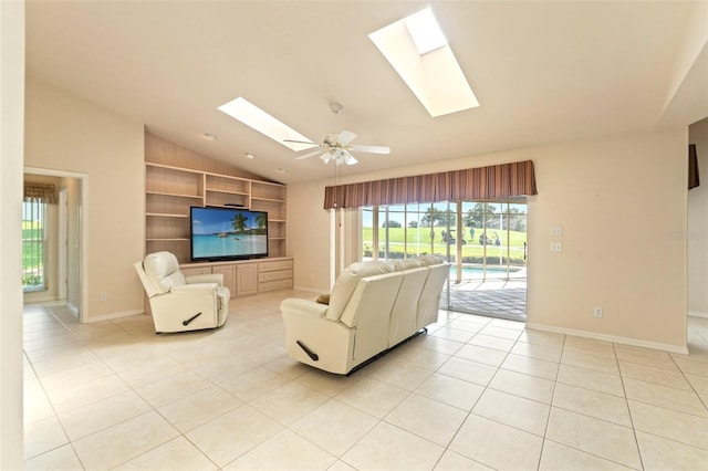 7328 Blue Skies Dr, Spring Hill, FL 34606 - living area featuring lofted ceiling, a skylight, built in shelves, light tile patterned floors, and a ceiling fan