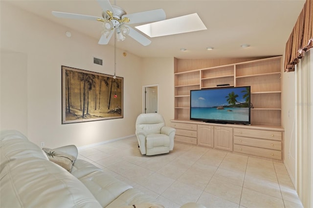 7328 Blue Skies Dr, Spring Hill, FL 34606 - living room with lofted ceiling, a skylight, light tile patterned flooring, ceiling fan, and built in shelves