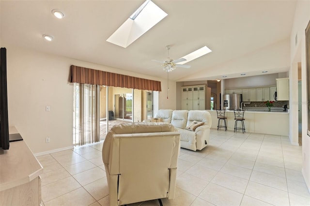 7328 Blue Skies Dr, Spring Hill, FL 34606 - living room with a skylight, light tile patterned floors, lofted ceiling, a ceiling fan, and recessed lighting