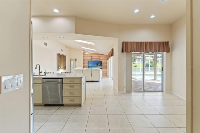 7328 Blue Skies Dr, Spring Hill, FL 34606 - kitchen featuring stainless steel dishwasher, cream cabinetry, light countertops, open floor plan, and recessed lighting