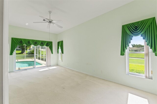 7328 Blue Skies Dr, Spring Hill, FL 34606 - carpeted spare room featuring a ceiling fan and healthy amount of natural light
