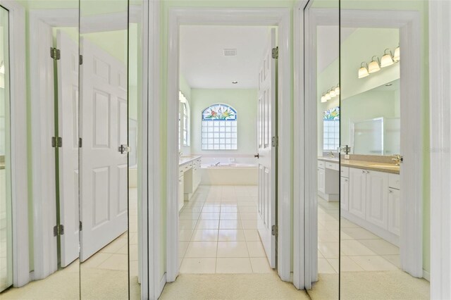 7328 Blue Skies Dr, Spring Hill, FL 34606 - hall with light tile patterned floors