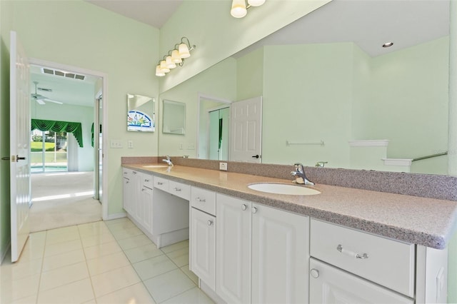 7328 Blue Skies Dr, Spring Hill, FL 34606 - bathroom featuring double vanity, tile patterned floors, and a ceiling fan
