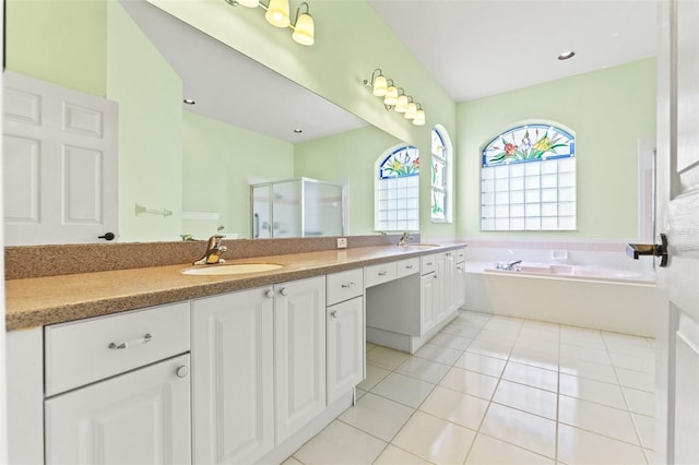 7328 Blue Skies Dr, Spring Hill, FL 34606 - full bath with double vanity, a stall shower, tile patterned floors, and a garden tub