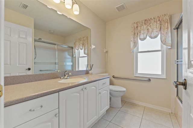 7328 Blue Skies Dr, Spring Hill, FL 34606 - bathroom with vanity, tile patterned flooring, and shower / bath combination with glass door
