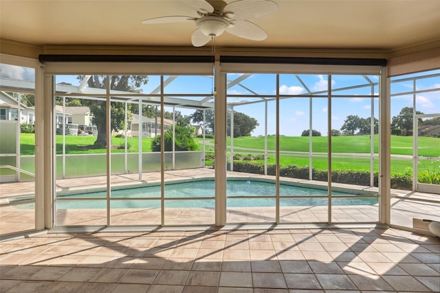 7328 Blue Skies Dr, Spring Hill, FL 34606 - outdoor pool with golf course view, glass enclosure, and a ceiling fan