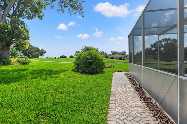 7328 Blue Skies Dr, Spring Hill, FL 34606 - view of grassy yard with a lanai