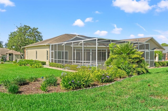 7328 Blue Skies Dr, Spring Hill, FL 34606 - back of property with a lawn, a lanai, and stucco siding