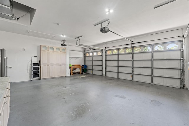 7328 Blue Skies Dr, Spring Hill, FL 34606 - garage featuring a garage door opener