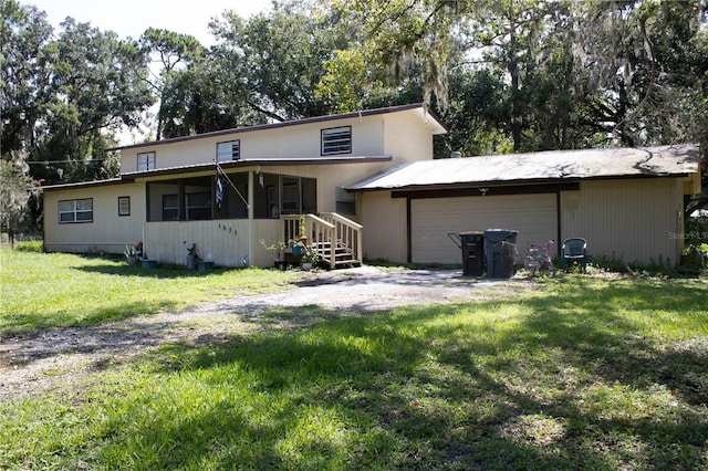 5635 Kimball Rd, Mulberry, FL 33860 - back of property featuring a yard and driveway