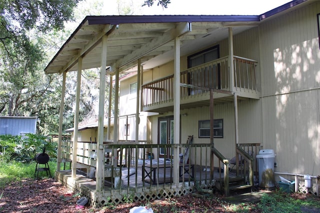 5635 Kimball Rd, Mulberry, FL 33860 - back of property featuring a balcony and a deck