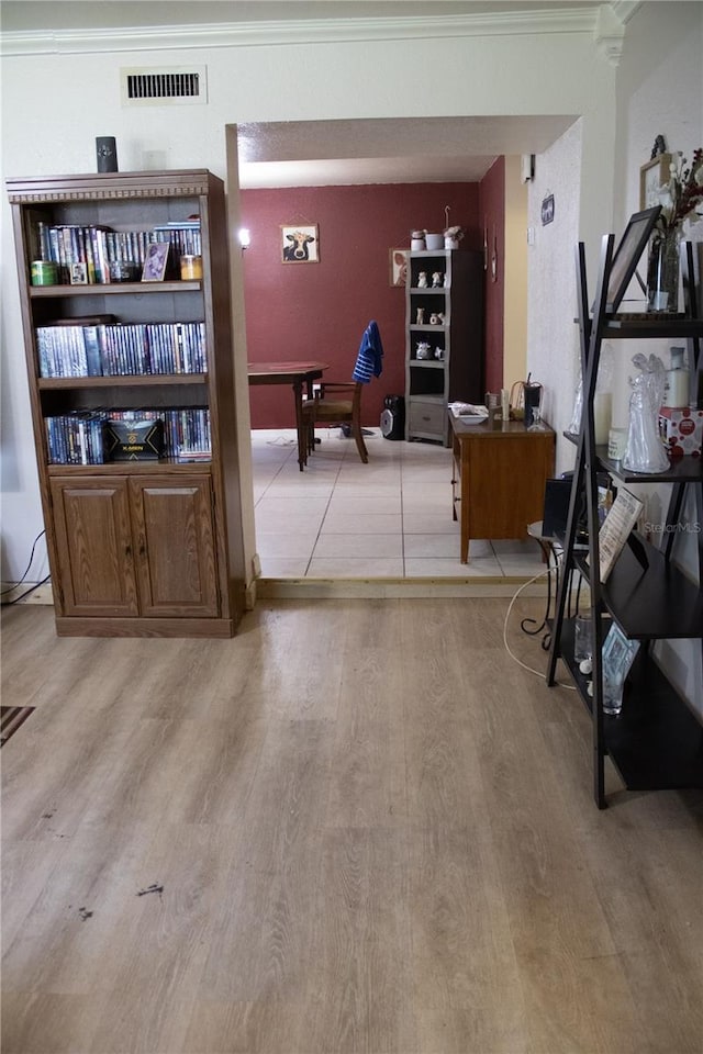 5635 Kimball Rd, Mulberry, FL 33860 - sitting room featuring ornamental molding, light wood-style flooring, and a desk
