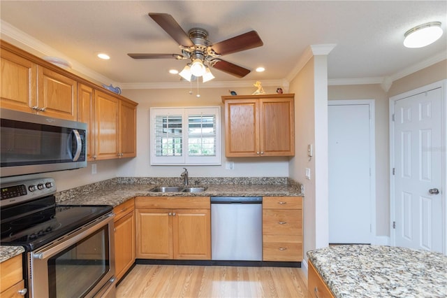 4452 Garnet Dr Unit 302, New Port Richey, FL 34652 - kitchen featuring appliances with stainless steel finishes, ornamental molding, light wood-type flooring, a ceiling fan, and light stone counters