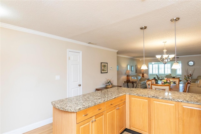 4452 Garnet Dr Unit 302, New Port Richey, FL 34652 - kitchen with a chandelier, ornamental molding, a textured ceiling, open floor plan, and decorative light fixtures