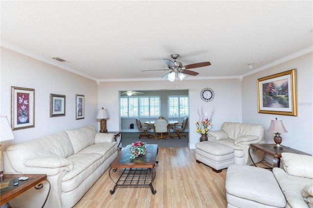 4452 Garnet Dr Unit 302, New Port Richey, FL 34652 - living area featuring light wood finished floors, crown molding, and a ceiling fan