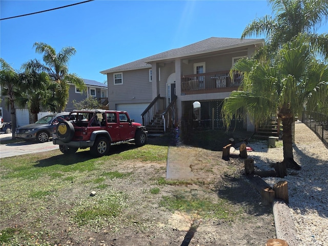 5420 Bay Blvd, Port Richey, FL 34668 - view of front of property featuring stairs, driveway, and a garage