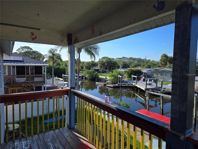 5420 Bay Blvd, Port Richey, FL 34668 - wooden deck with a water view and a boat dock
