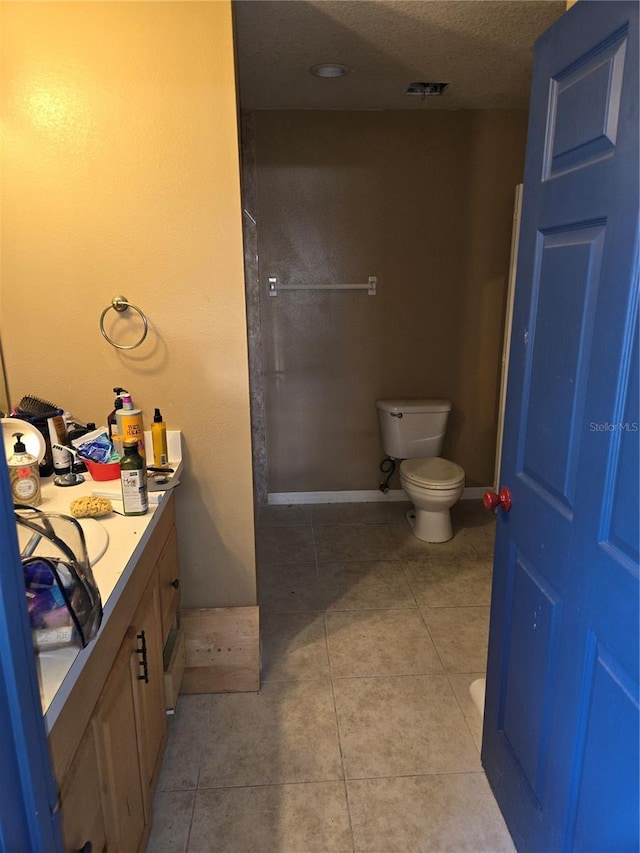 5420 Bay Blvd, Port Richey, FL 34668 - bathroom with tile patterned flooring, vanity, and a textured ceiling