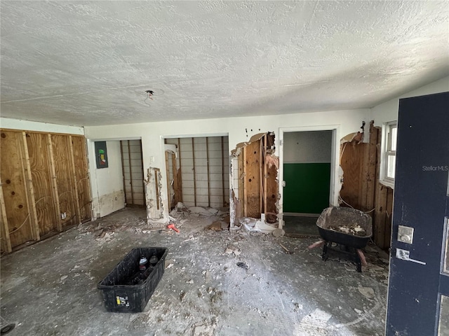 34767 Evergreen Way, Ridge Manor, FL 33523 - unfurnished living room featuring a textured ceiling