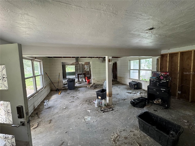 34767 Evergreen Way, Ridge Manor, FL 33523 - unfurnished living room featuring a textured ceiling