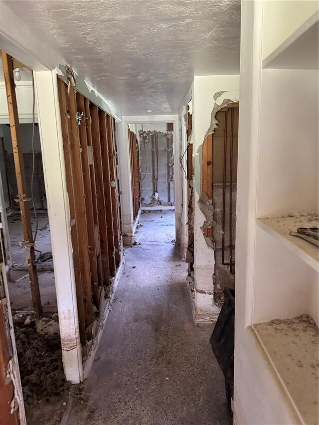34767 Evergreen Way, Ridge Manor, FL 33523 - corridor featuring a textured ceiling