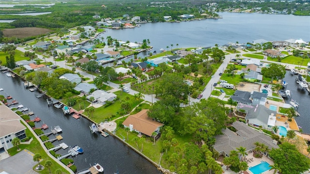 8143 Channel Dr, Port Richey, FL 34668 - aerial view of property and surrounding area featuring a large body of water and nearby suburban area