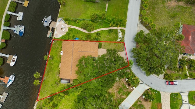 8143 Channel Dr, Port Richey, FL 34668 - aerial view of property's location featuring a nearby body of water and property parcel outlined