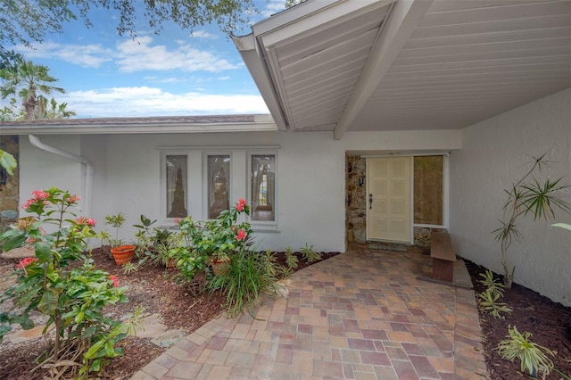 8143 Channel Dr, Port Richey, FL 34668 - property entrance with stucco siding