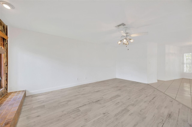 8143 Channel Dr, Port Richey, FL 34668 - empty room featuring ceiling fan and light wood finished floors