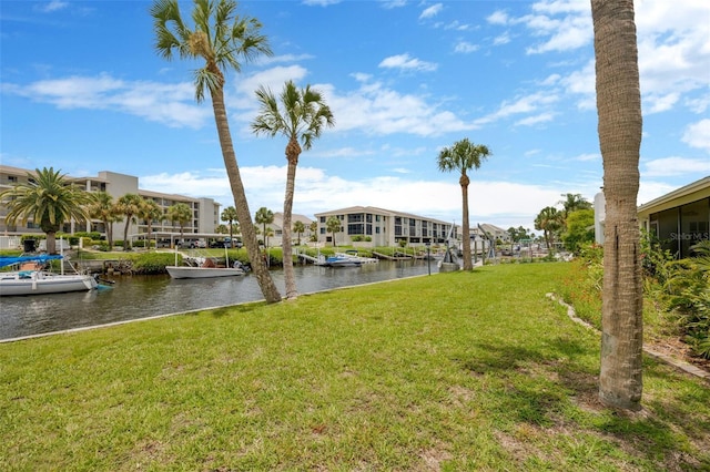 8143 Channel Dr, Port Richey, FL 34668 - view of green lawn featuring a water view