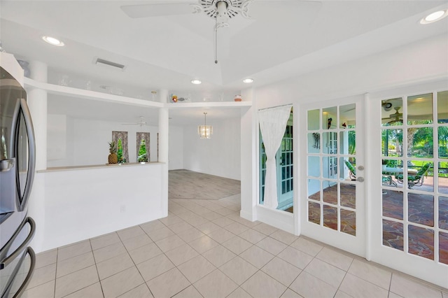 8143 Channel Dr, Port Richey, FL 34668 - spare room with a ceiling fan, recessed lighting, light tile patterned flooring, and a chandelier