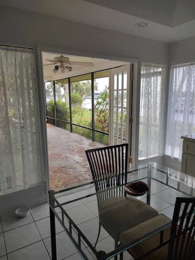 8143 Channel Dr, Port Richey, FL 34668 - sunroom featuring plenty of natural light and tile patterned floors