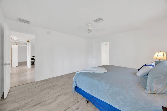 8143 Channel Dr, Port Richey, FL 34668 - bedroom featuring wood finished floors and a ceiling fan