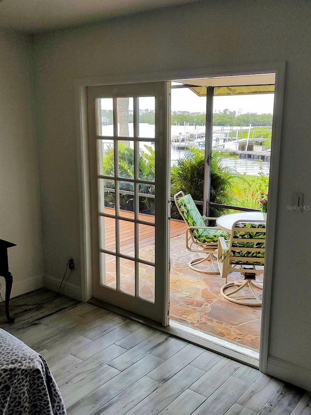 8143 Channel Dr, Port Richey, FL 34668 - entryway featuring a water view and wood finished floors
