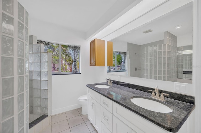 8143 Channel Dr, Port Richey, FL 34668 - full bath featuring a walk in shower, tile patterned flooring, and double vanity