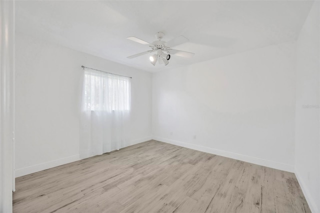 8143 Channel Dr, Port Richey, FL 34668 - unfurnished room with wood finished floors and a ceiling fan