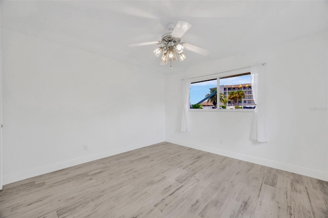 8143 Channel Dr, Port Richey, FL 34668 - empty room featuring wood finished floors and ceiling fan