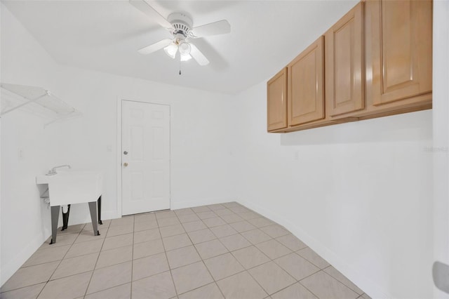 8143 Channel Dr, Port Richey, FL 34668 - laundry room with a ceiling fan and baseboards