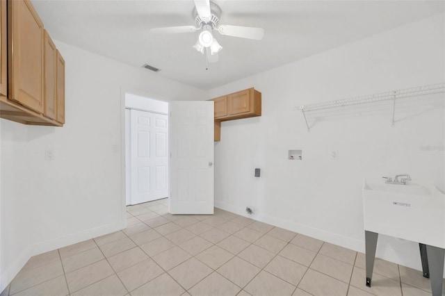 8143 Channel Dr, Port Richey, FL 34668 - laundry room featuring cabinet space, hookup for a washing machine, ceiling fan, and hookup for an electric dryer