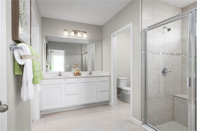 10864 SW 73rd Ct, Ocala, FL 34476 - bathroom with a stall shower, double vanity, and tile patterned flooring