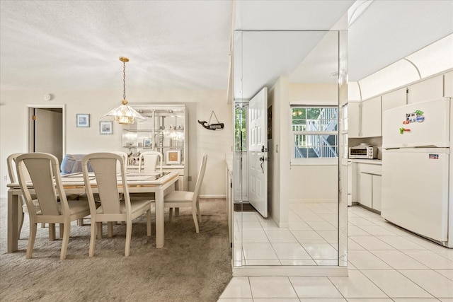 12141 Spartan Way Unit 102, Hudson, FL 34667 - dining area featuring light tile patterned floors and baseboards