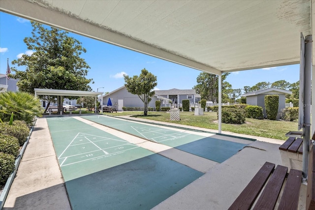 12141 Spartan Way Unit 102, Hudson, FL 34667 - surrounding community featuring shuffleboard and a lawn