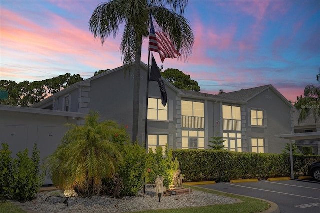 12141 Spartan Way Unit 102, Hudson, FL 34667 - view of property featuring uncovered parking